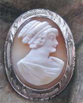 Stylishly carved shell - upper hair woman from 1935 - 1955 Hallmarked STERLING Etched Silver Brooch.