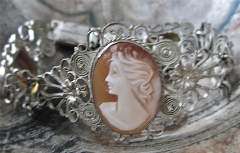 Hand carved shell with two citrin yellow stone circa 1955 In unmarked Silver Filigree Bracelet but hallmarked “GM”