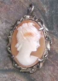 The little Edwardian hand carved shell signed by Artist Marked 800 Silver with marcacite brooch/pendant.