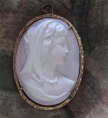 Beautiful hand carved Coral stone Goddess circa 1940 Italian Gold washed Silver brooch/pendant. Signed.