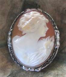 Greatly Carved Carnelian Shell Signed by the Artist. Filigree Silver Vintage Brooch from 1925-1935.