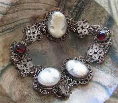 The good hand carved 4 shells - women from 1920-1940 Silver plated filigree with stones Bracelet & Pendant Set.