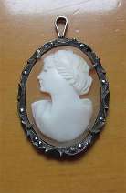 Left faced hand carved/signed Classic Art Deco shell 800 Silver with marcasite pendant circa 1920th.