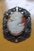 Well hand carved/signed shell circa 1920th-1930th Silver filigree/marcasite brooch with patina.