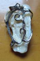 Hand carved/signed Mother pearl - torso Silver plated decorative pendant.
