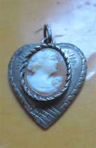Great hand carved/signed shell circa 1930th-1940th. Heart shaped Silver engraved/etched pendant.