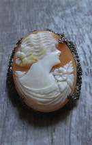 Well hand carved/signed shell circa 1920th-1930th Silver filigree brooch with patina.